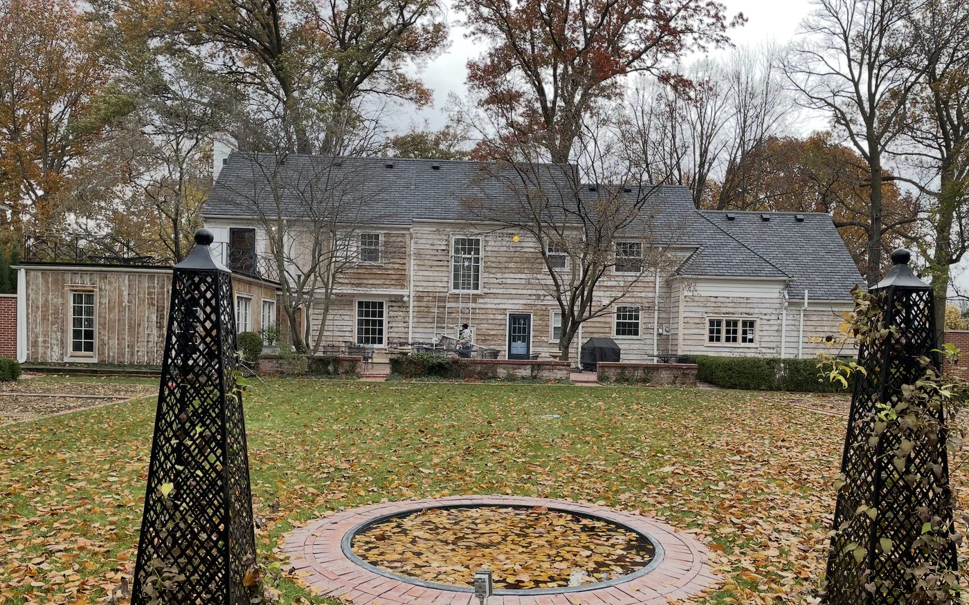 Home exterior with weathered, faded siding before repainting
